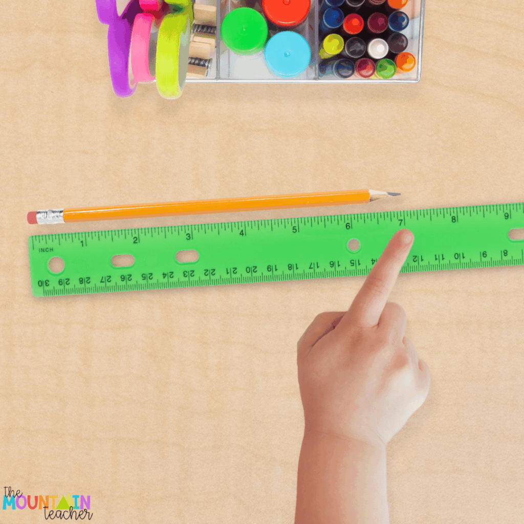 This image shows a child using a ruler.